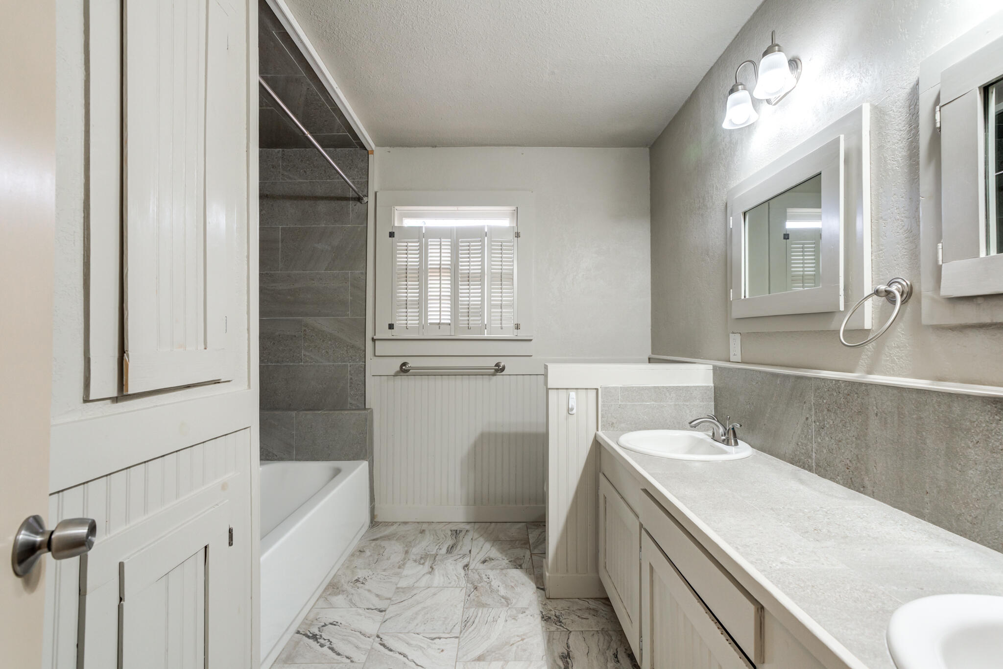 3517 47th Street Lubbock, TX 79413 - Photo 22 of 36 a bathroom with a sink toilet and shower