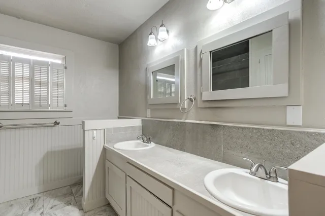 a bathroom with a sink and a vanity