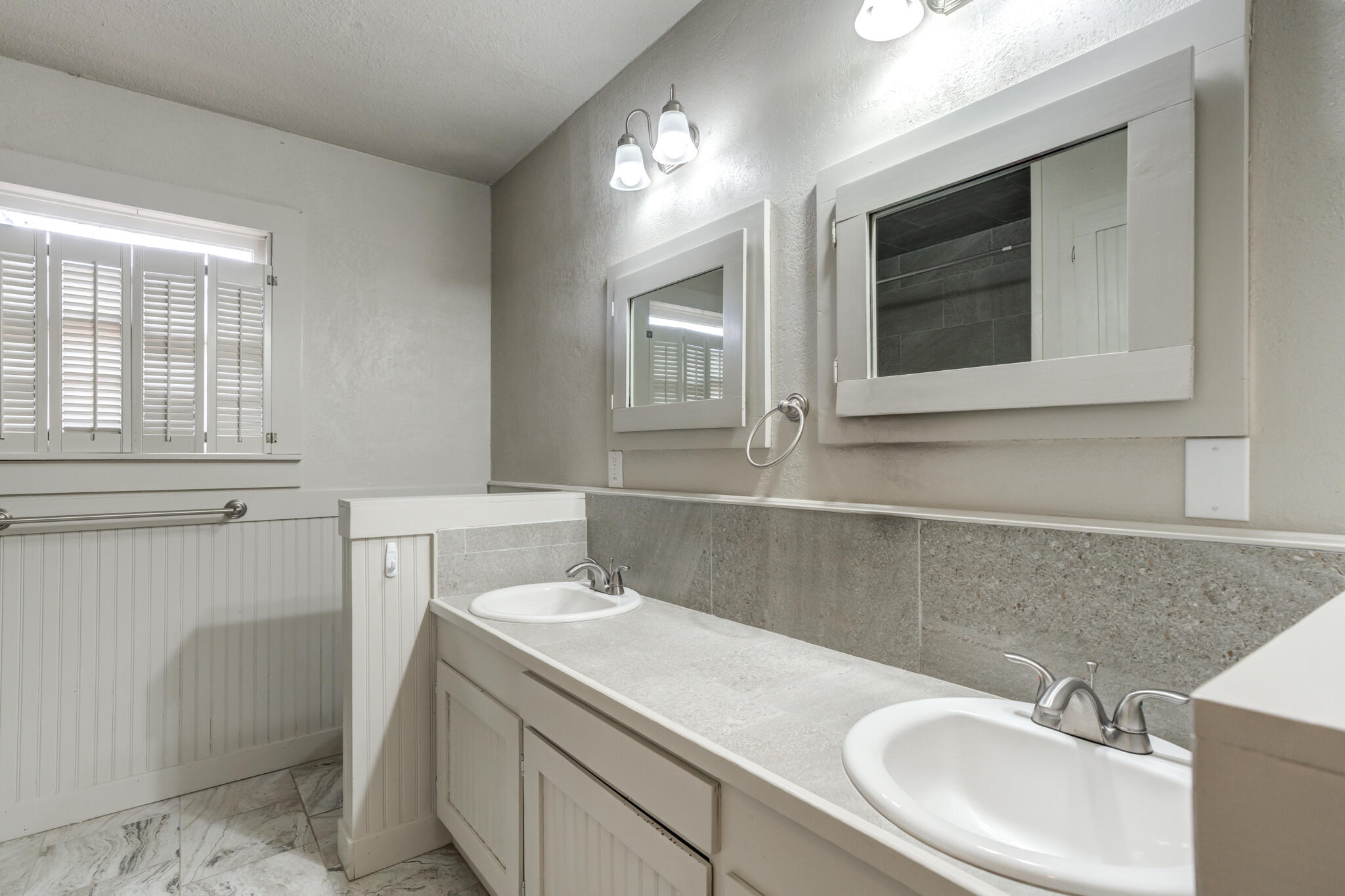 3517 47th Street Lubbock, TX 79413 - Photo 23 of 36 a bathroom with a sink and a vanity