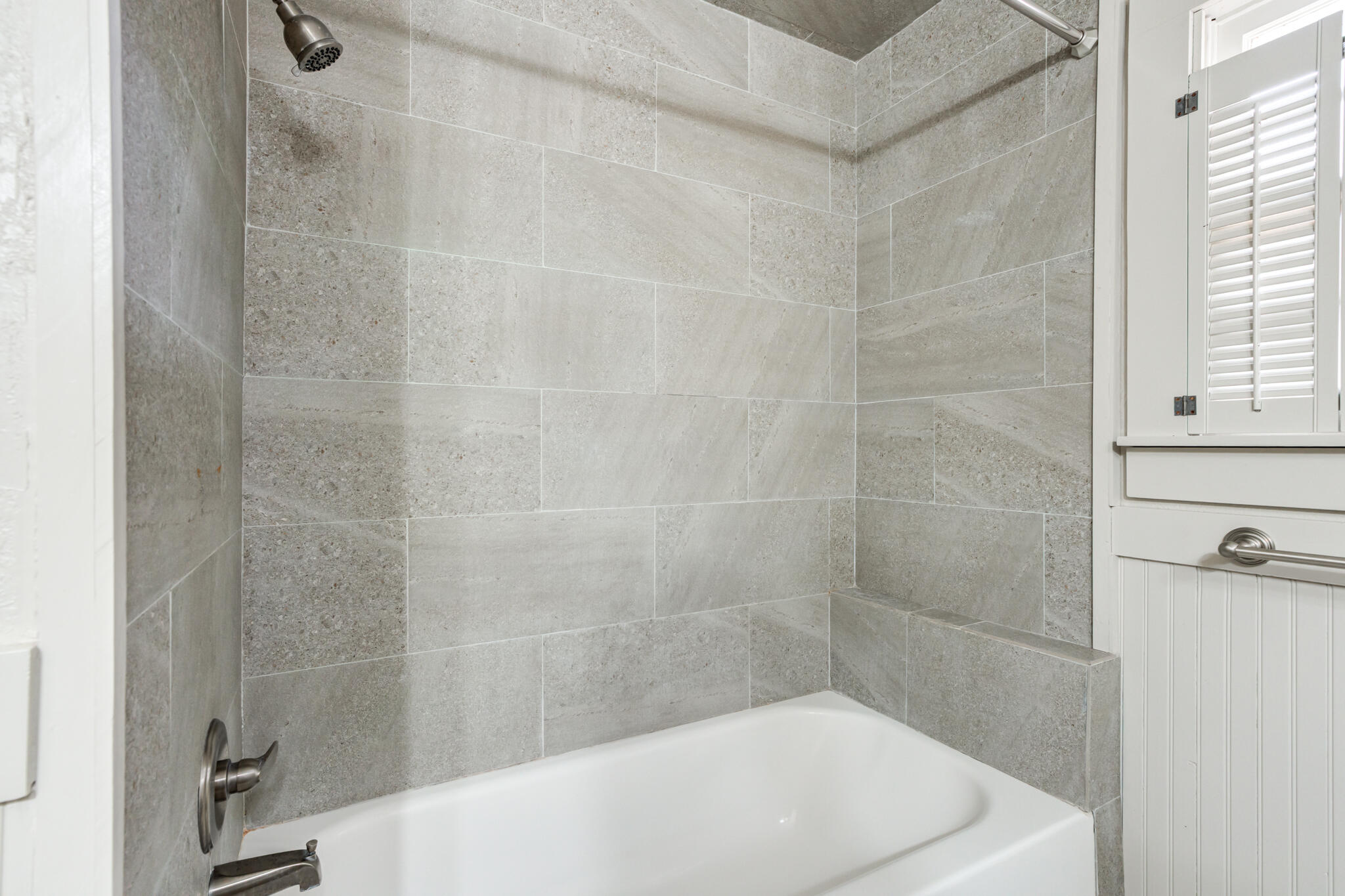 3517 47th Street Lubbock, TX 79413 - Photo 24 of 36 a bathroom with a bathtub