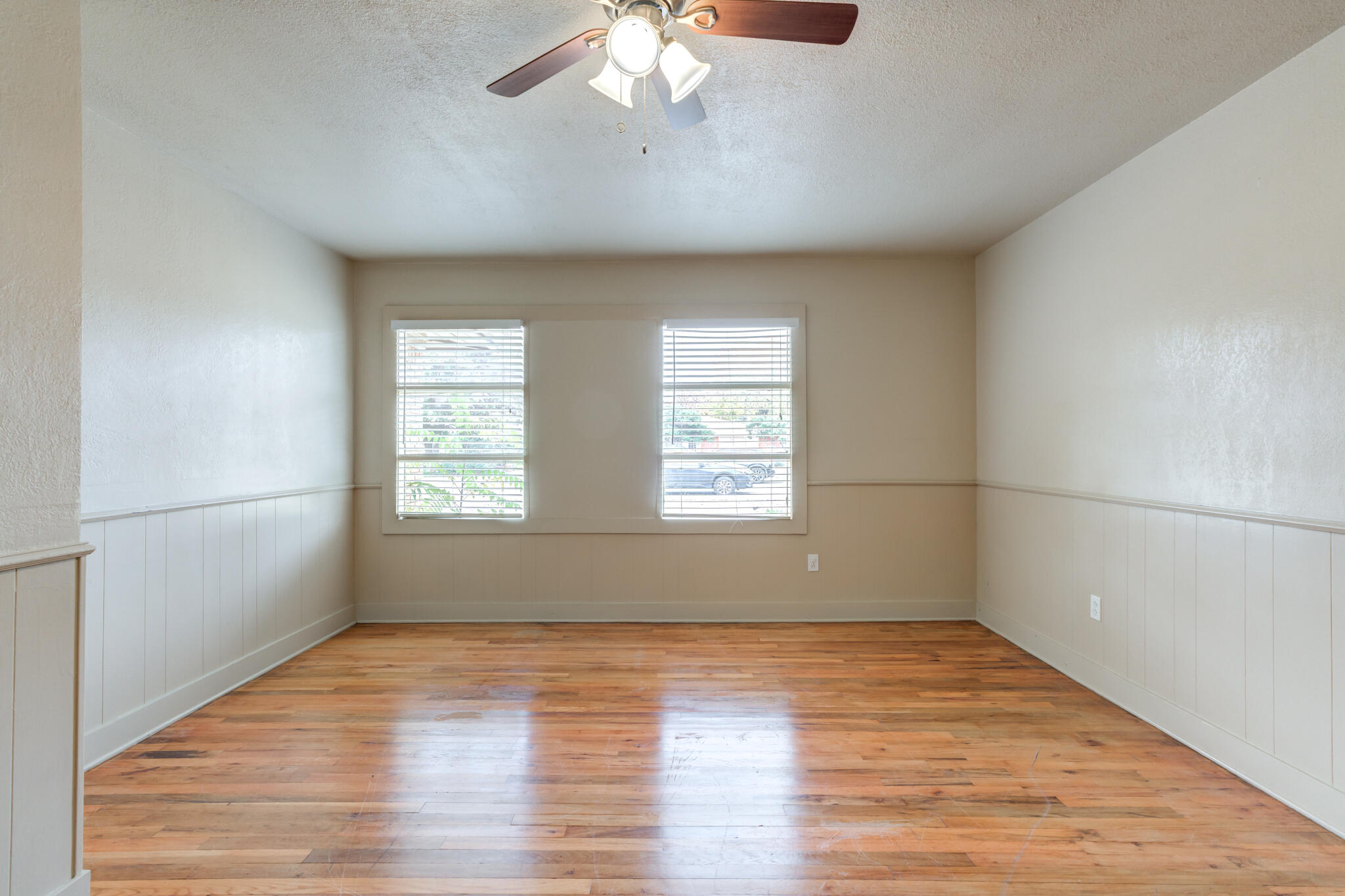 3517 47th Street Lubbock, TX 79413 - Photo 25 of 36 wooden floor in an empty room with a window