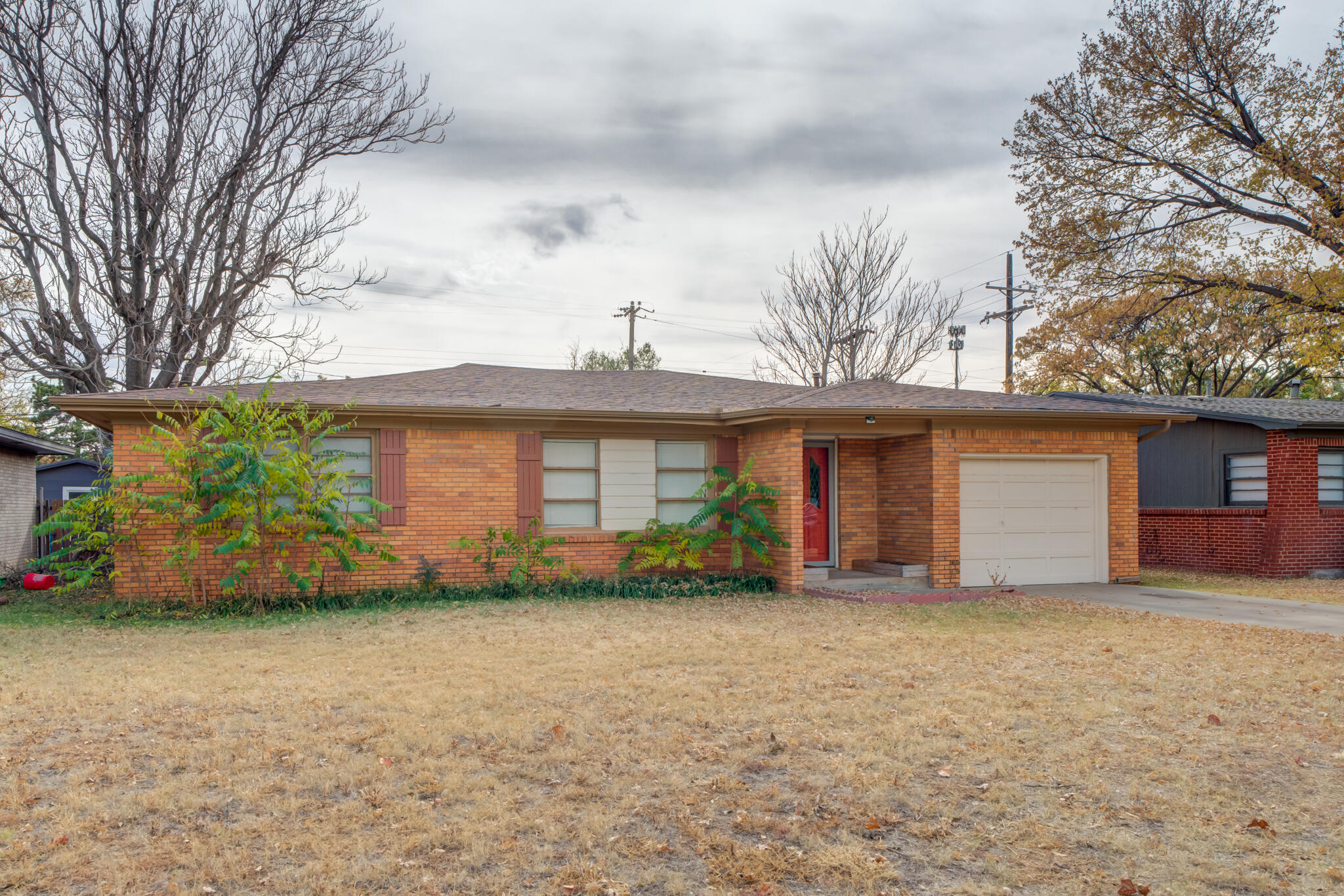 3517 47th Street Lubbock, TX 79413 - Photo 3 of 36 a front view of house with yard and trees