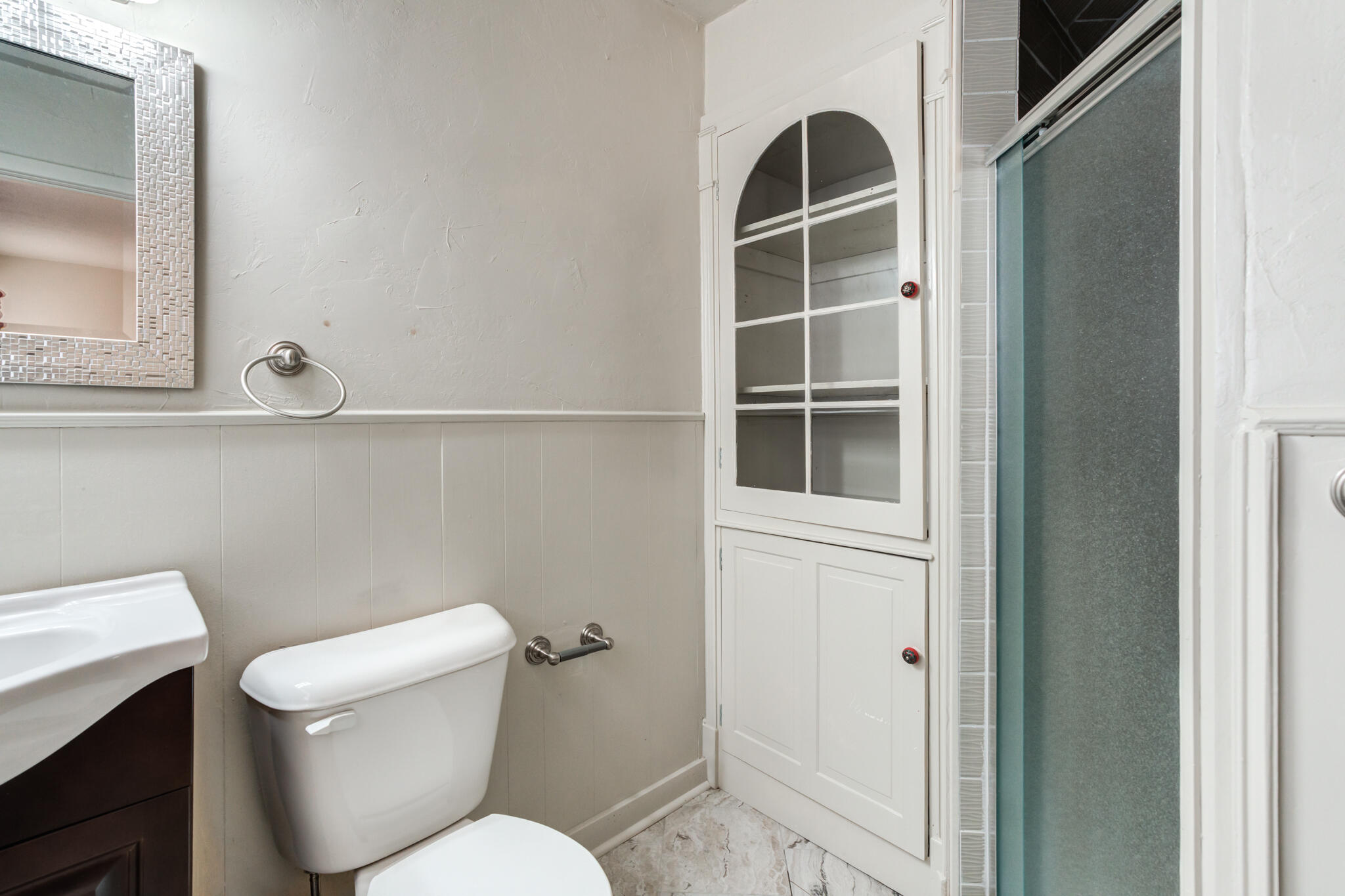 3517 47th Street Lubbock, TX 79413 - Photo 32 of 36 a white toilet sitting next to a bathroom sink