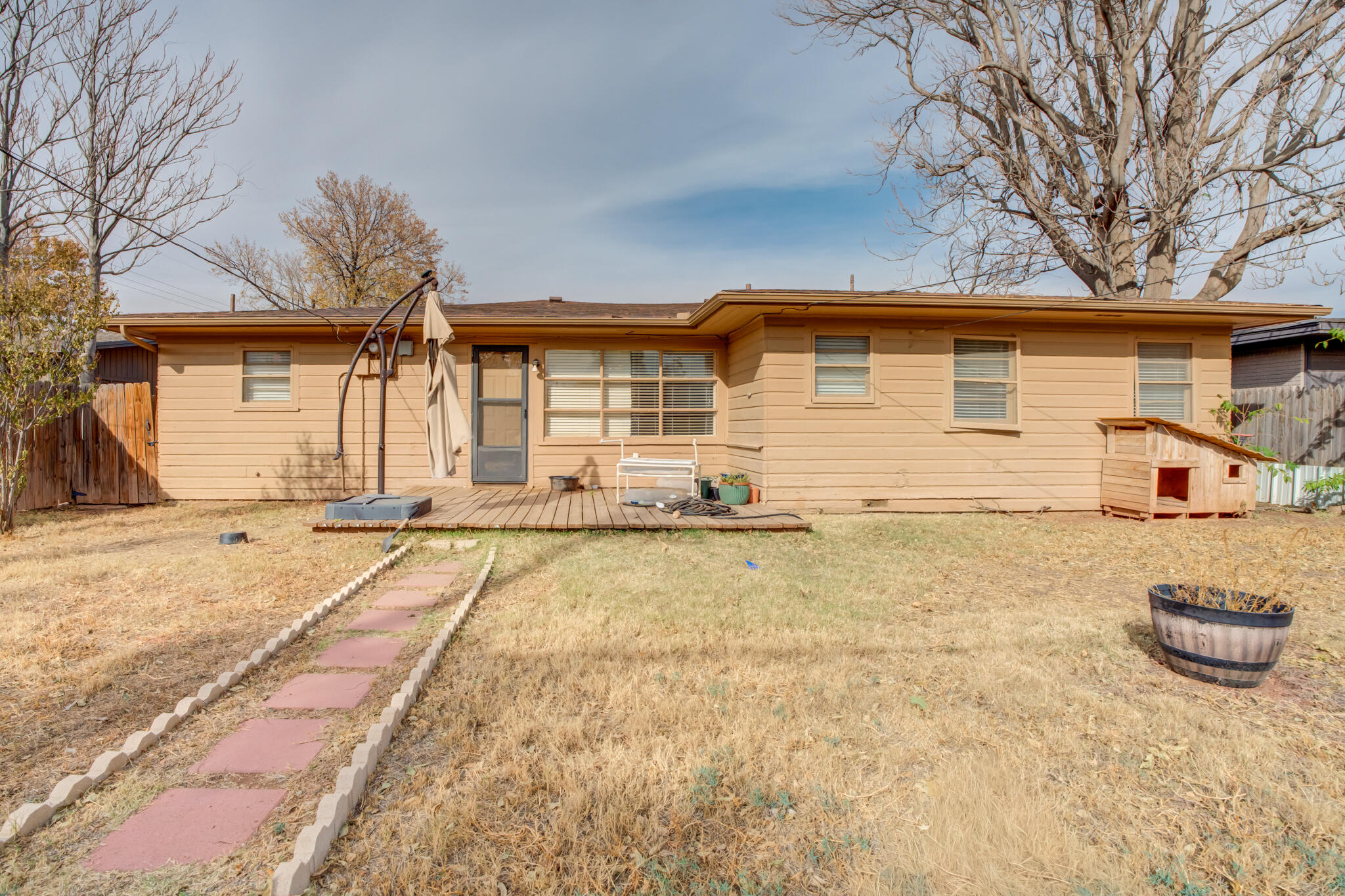 3517 47th Street Lubbock, TX 79413 - Photo 36 of 36 a front view of a house with a yard and garage