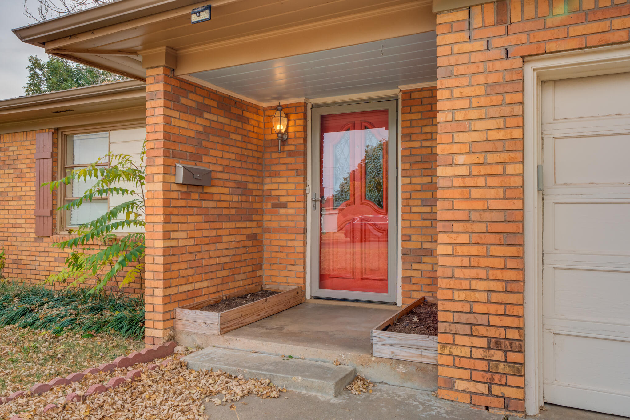 3517 47th Street Lubbock, TX 79413 - Photo 4 of 36 a front view of a house with a yard