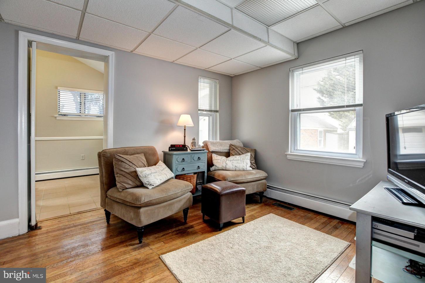 10009 Sutherland Road Silver Spring, MD 20901 - Photo 12 of 27 a living room with furniture rug and window