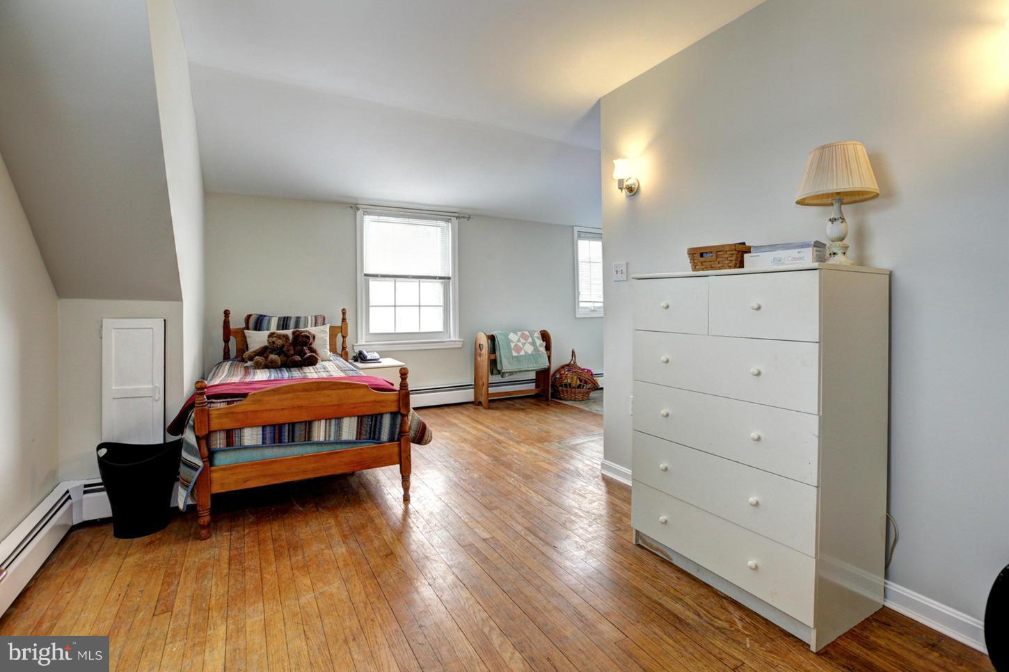 10009 Sutherland Road Silver Spring, MD 20901 - Photo 15 of 27 a bedroom with a bed and window