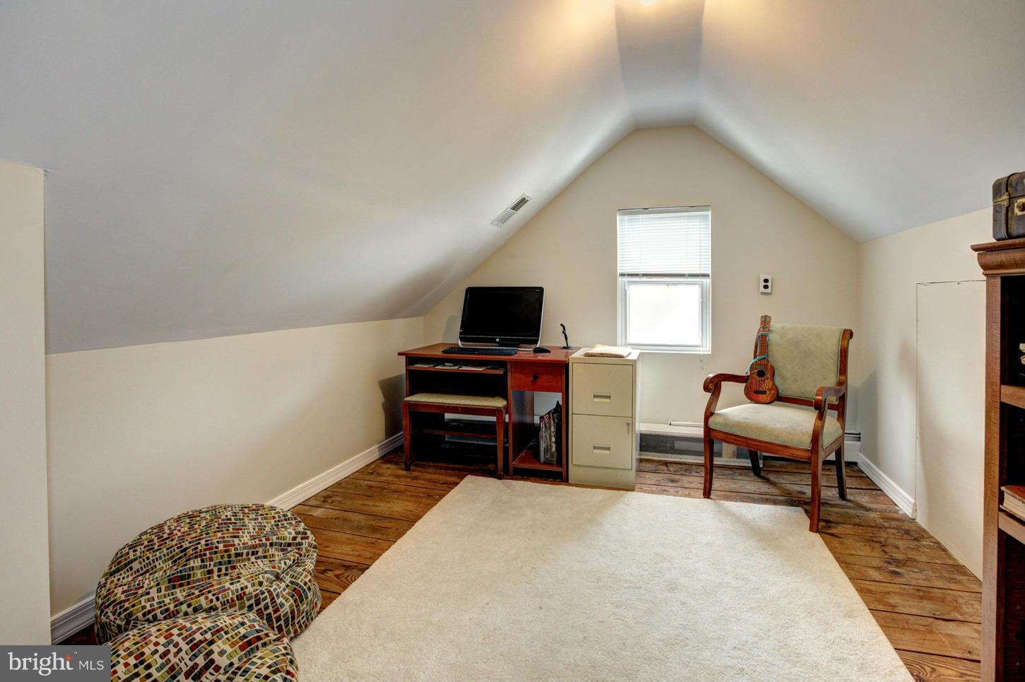 10009 Sutherland Road Silver Spring, MD 20901 - Photo 18 of 27 a bedroom with furniture and a window