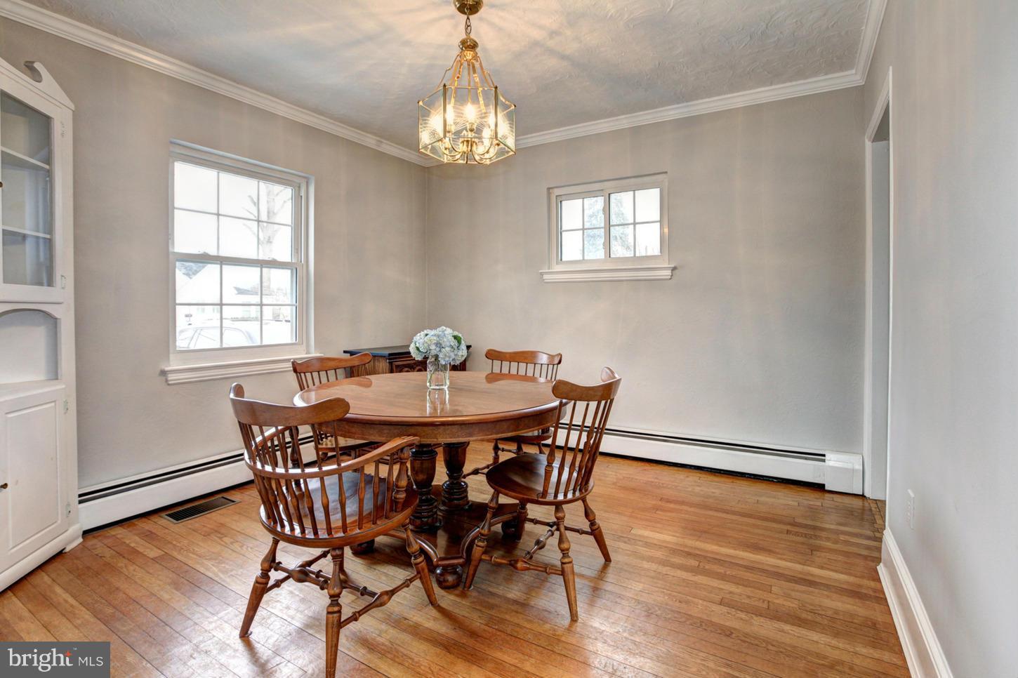 10009 Sutherland Road Silver Spring, MD 20901 - Photo 5 of 27 a view of a dining room with furniture window and wooden floor