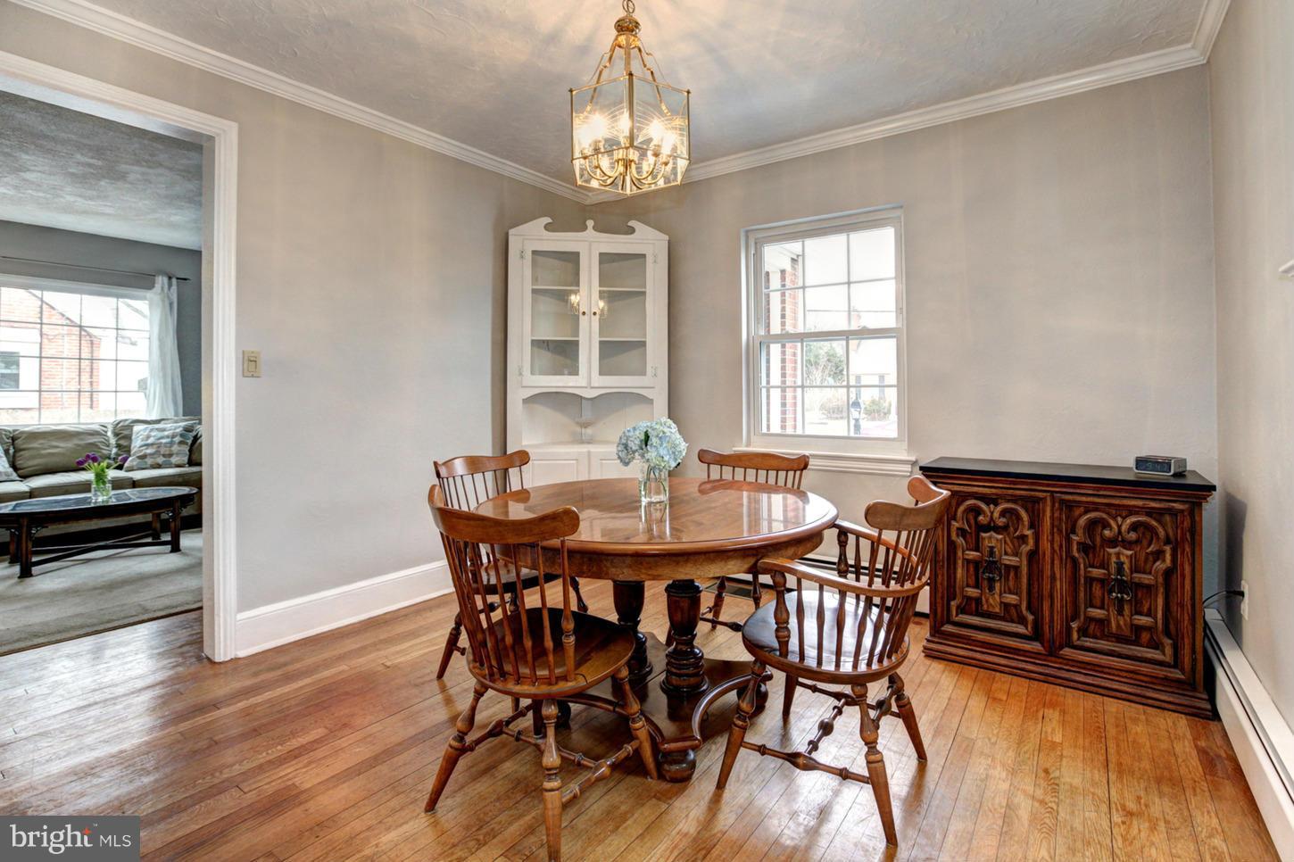 10009 Sutherland Road Silver Spring, MD 20901 - Photo 6 of 27 a view of a dining room with furniture window and wooden floor
