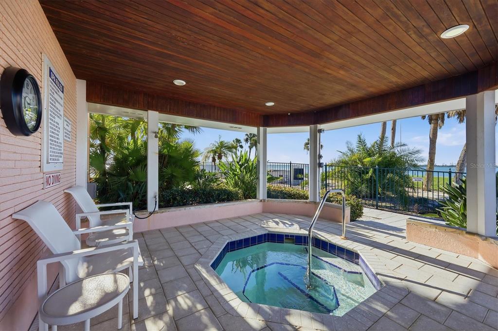 11000 Placida Road, Unit 302 Placida, FL 33946 - Photo 57 of 68 a swimming pool with outdoor seating yard and patio