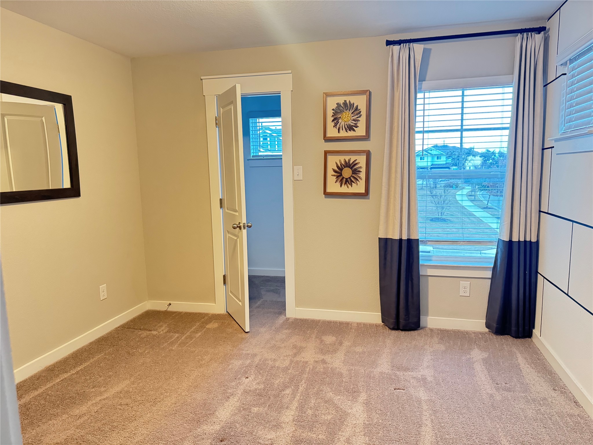 2328 Calvert Drive Leander, TX 78641 - Photo 9 of 17 a view of a big room with a window and a bathroom