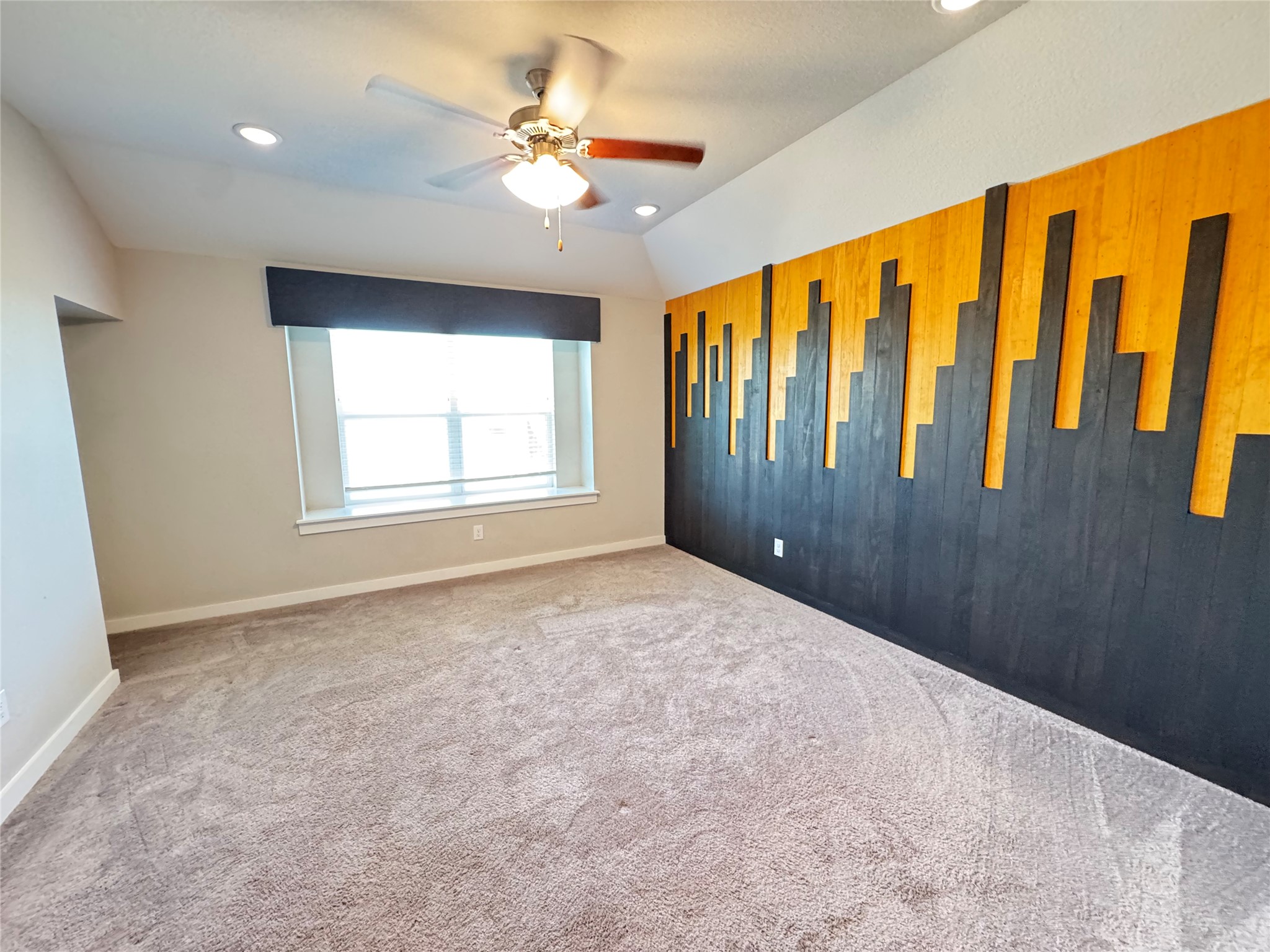 2328 Calvert Drive Leander, TX 78641 - Photo 21 of 35 Accent wall with black and yellow wood paneling