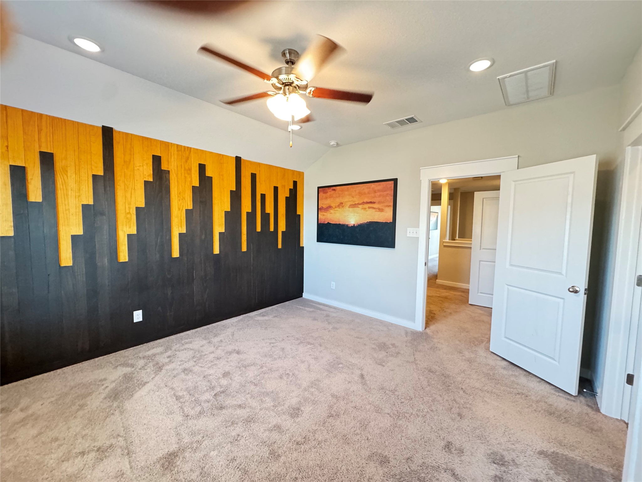 2328 Calvert Drive Leander, TX 78641 - Photo 23 of 35 Textured accent wall featuring a two-tone wood panel design