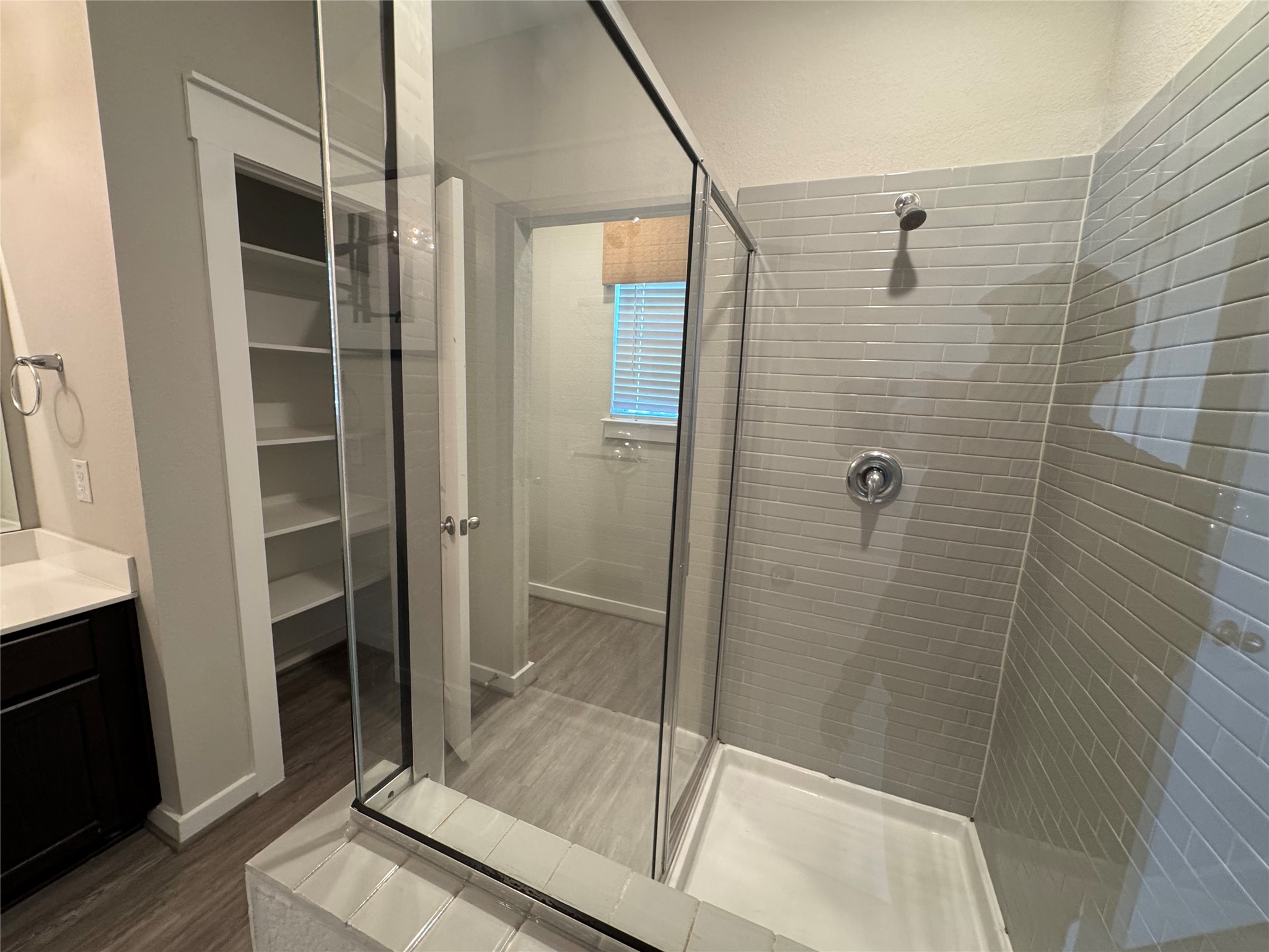 2328 Calvert Drive Leander, TX 78641 - Photo 27 of 35 Glass-enclosed shower with subway tile surround and chrome fixtures
