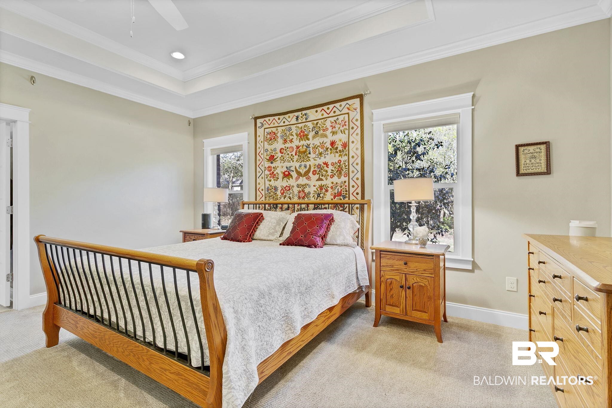20105 Bunker Loop Fairhope, AL 36532 - Photo 28 of 65 Bedroom featuring light carpet, crown molding, a raised ceiling, and baseboards