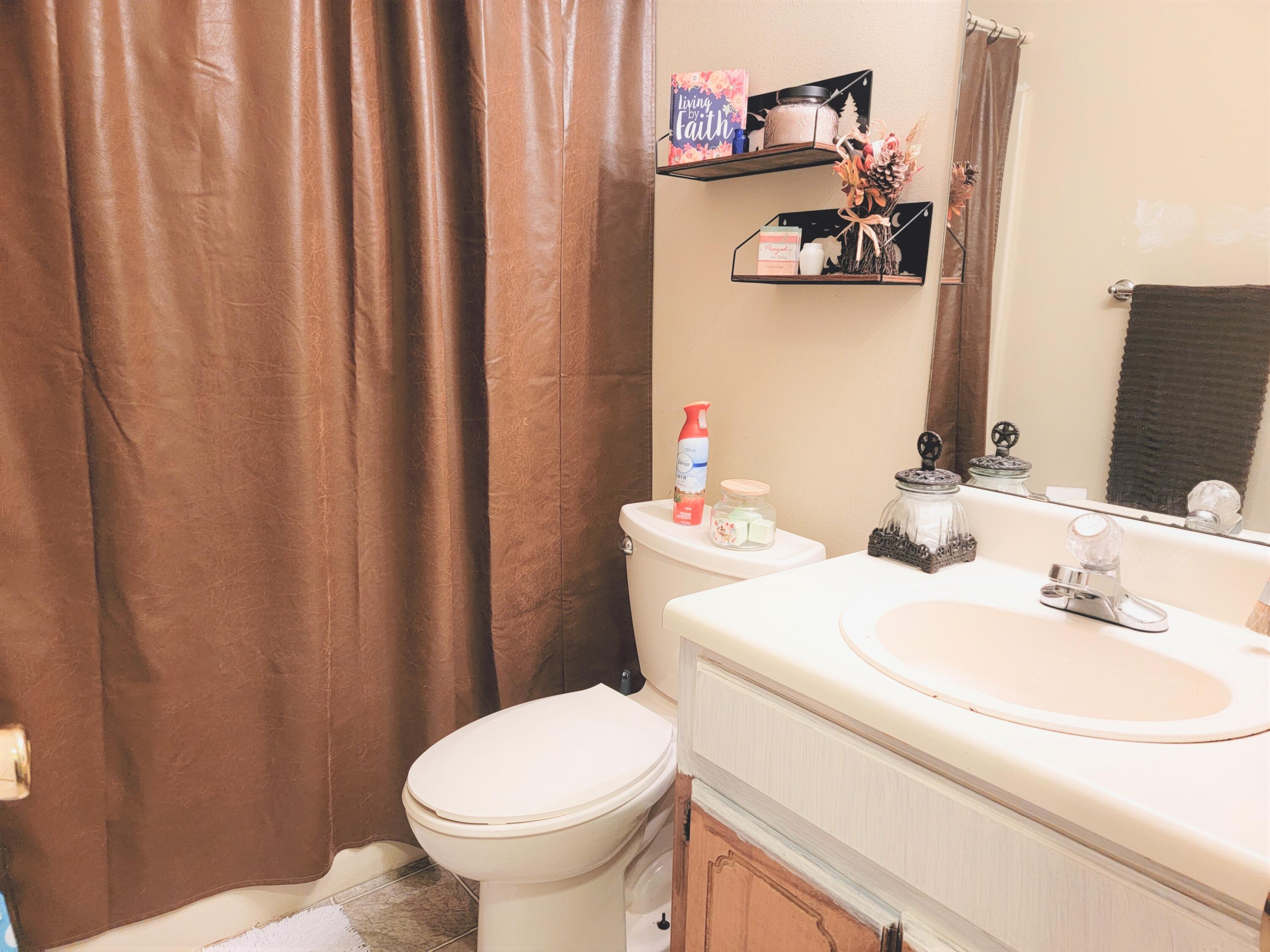 2830 Old Mill Way Crestview, FL 32539 - Photo 12 of 16 a bathroom with a sink and a toilet