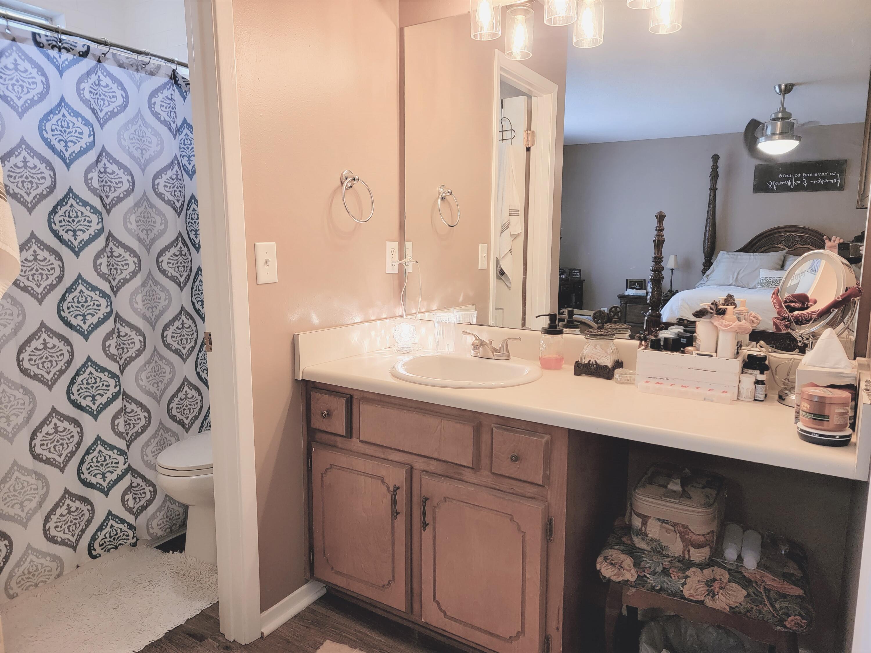 2830 Old Mill Way Crestview, FL 32539 - Photo 9 of 16 a bathroom with a sink and a mirror