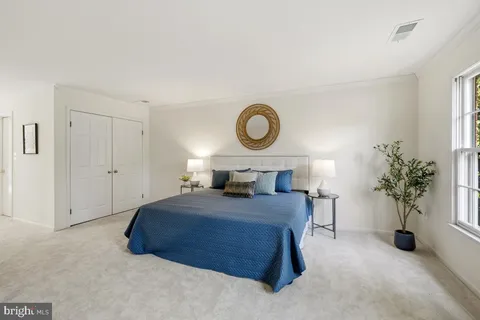 a living room with furniture and windows