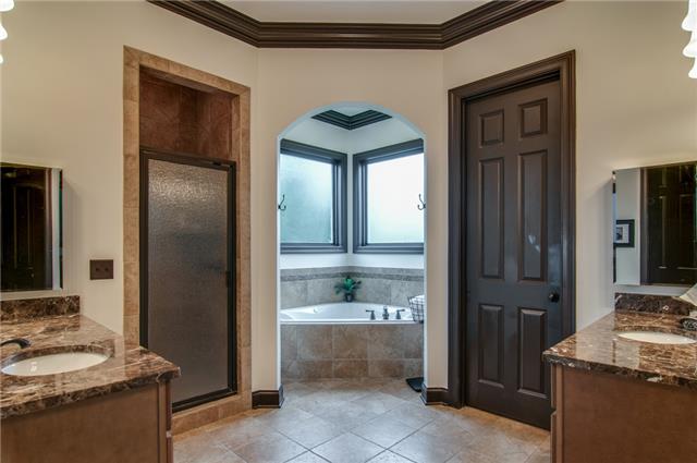 1334 Eliot Road Franklin, TN 37064 - Photo 12 of 20 Master bathroom has separate marble top vanities, mirrored medicine cabinets, spacious tile shower with seat, and a relaxing corner jetted tub