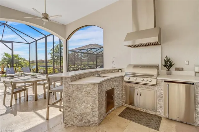 a kitchen with a stove and a white cabinets