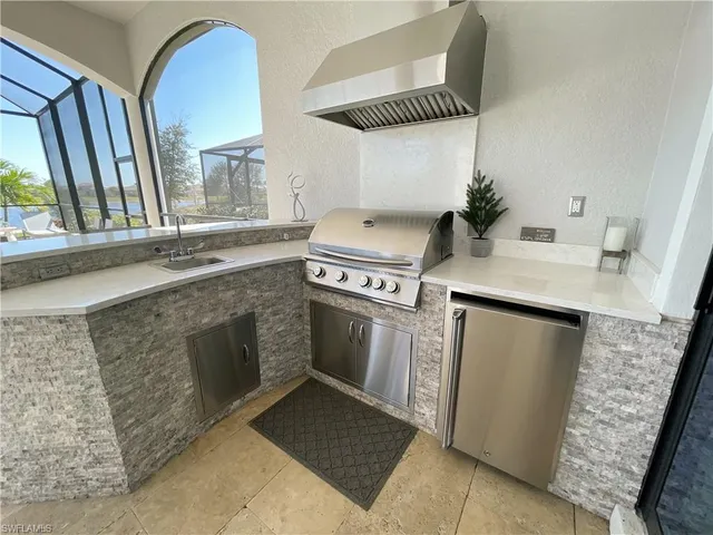 a kitchen with a stove and a sink