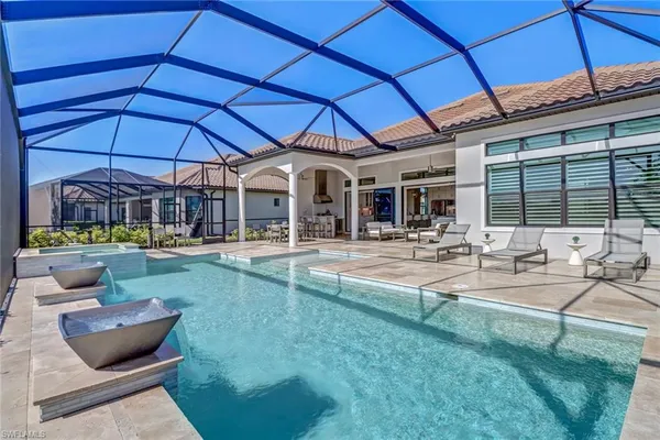 a view of a patio with swimming pool table and chairs