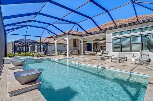 a view of a patio with swimming pool table and chairs