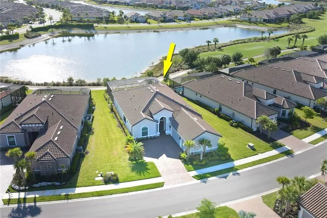 an aerial view of house with a swimming pool yard and outdoor seating