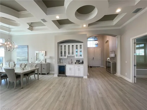 a large space with a large window and stainless steel appliances