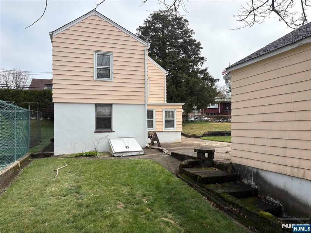 429 MacArthur Avenue Garfield, NJ 07026 - Photo 14 of 38 a front view of a house with garden