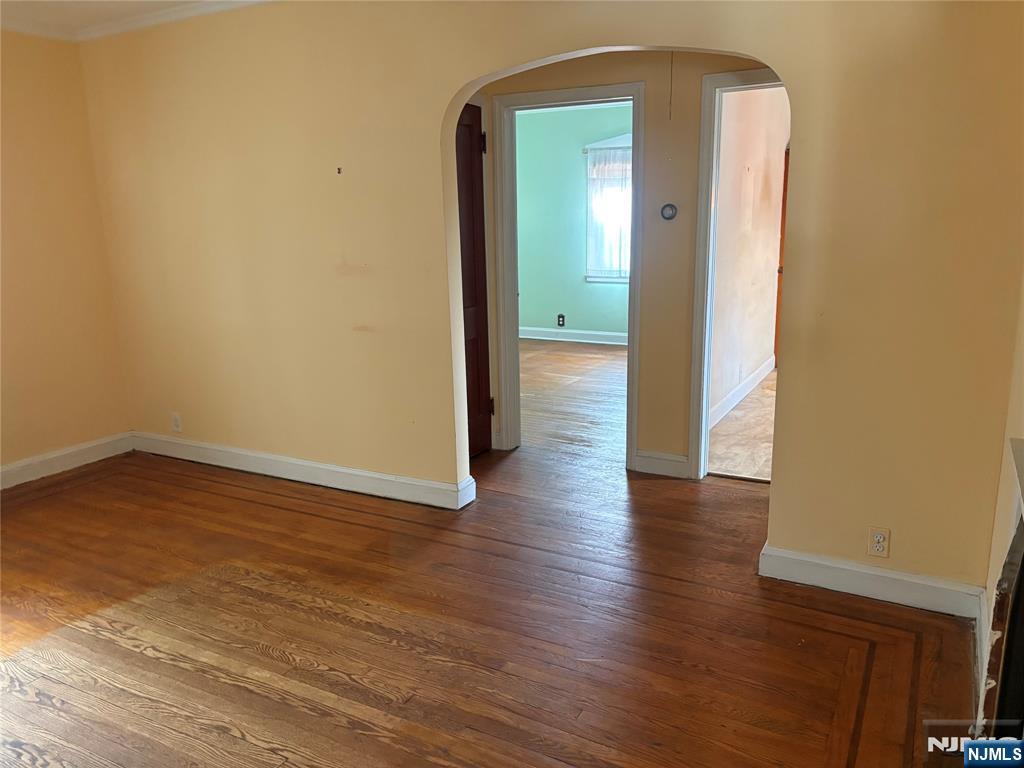 429 MacArthur Avenue Garfield, NJ 07026 - Photo 18 of 38 a view of a hallway with wooden floor