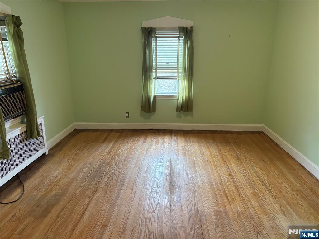 429 MacArthur Avenue Garfield, NJ 07026 - Photo 20 of 38 a view of empty room with wooden floor and fan