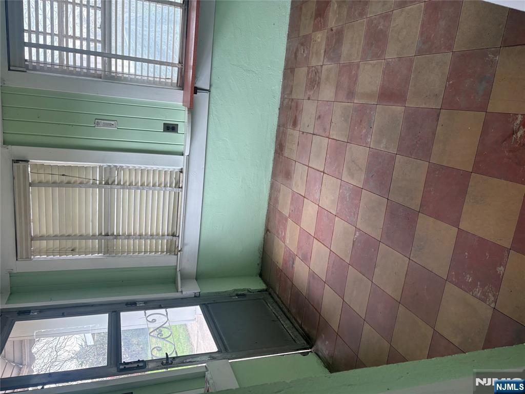 429 MacArthur Avenue Garfield, NJ 07026 - Photo 26 of 38 a view of a livingroom with an empty space and a window