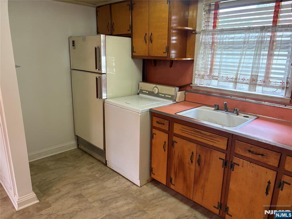 429 MacArthur Avenue Garfield, NJ 07026 - Photo 33 of 38 a utility room with dryer and washer