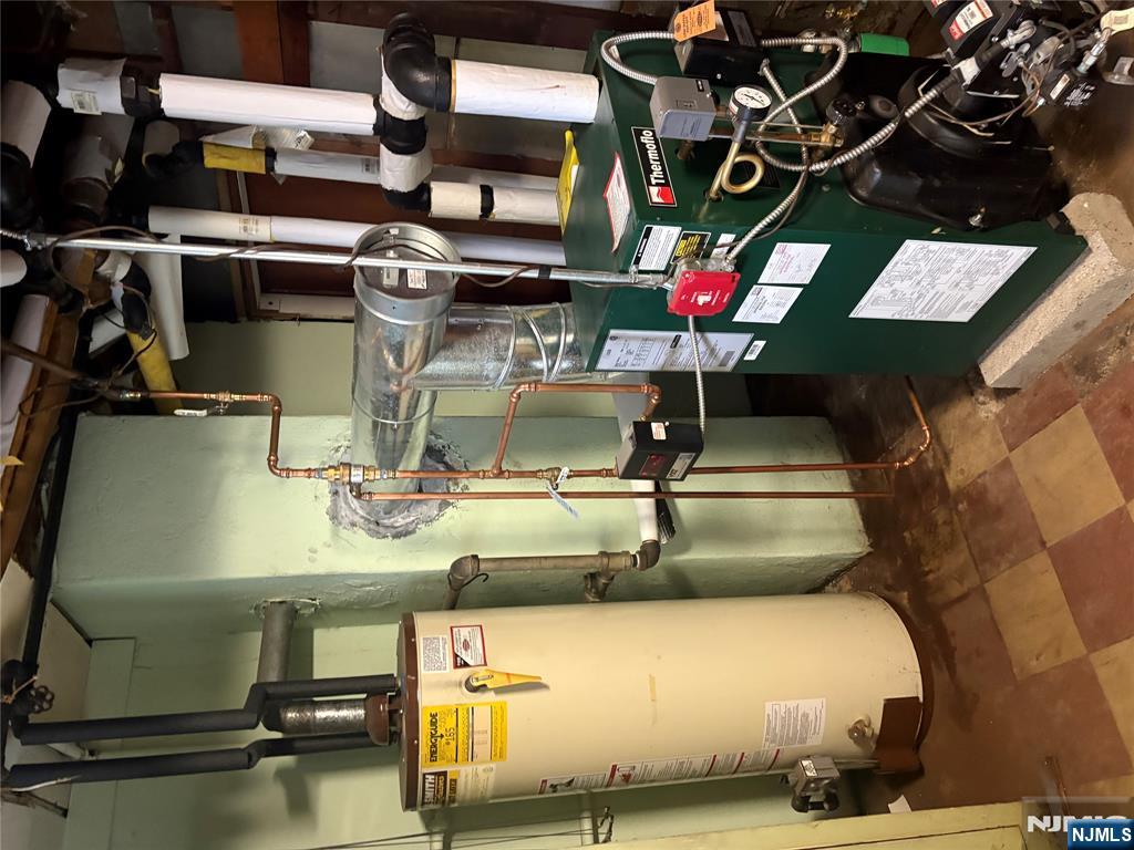 429 MacArthur Avenue Garfield, NJ 07026 - Photo 35 of 38 a utility room with lots of appliances