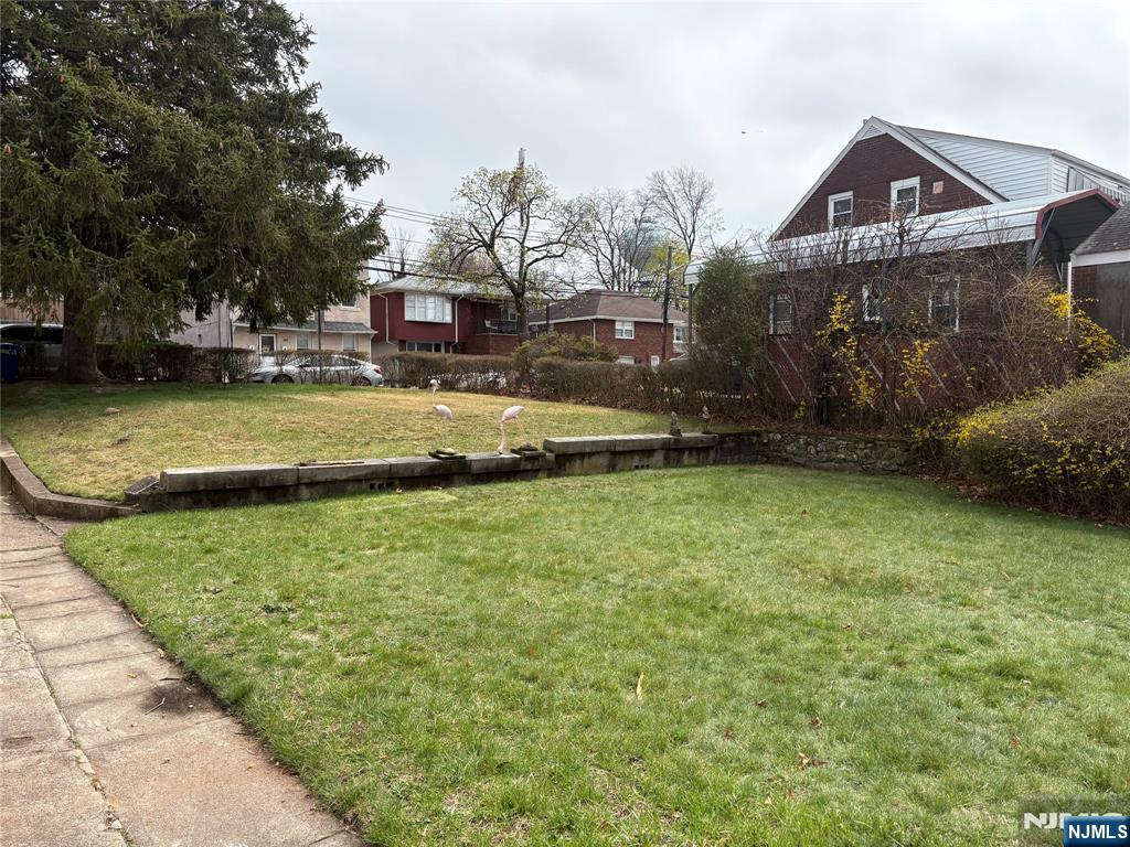 429 MacArthur Avenue Garfield, NJ 07026 - Photo 10 of 38 a view of a house with a yard