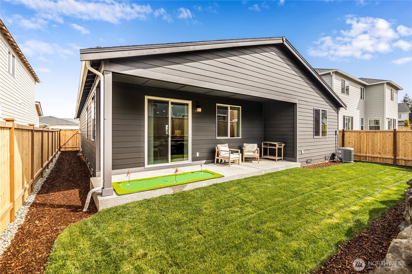 3416 Bittern Lane Port Orchard, WA 98367 - Photo 28 of 28 a view of a house with backyard and porch
