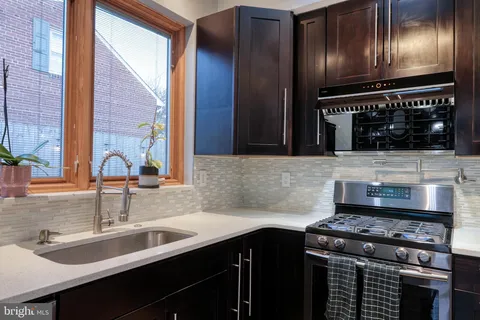 a view of a hallway with closet and front door
