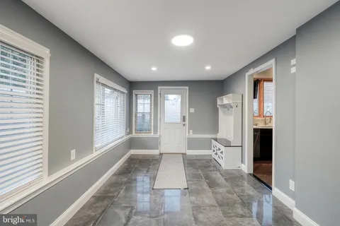 a kitchen with stainless steel appliances granite countertop wooden cabinets and a stove top oven