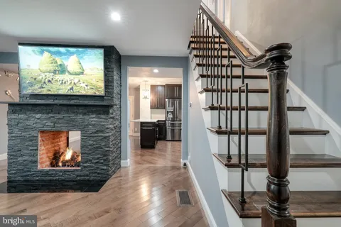 a room with wooden floor and a window
