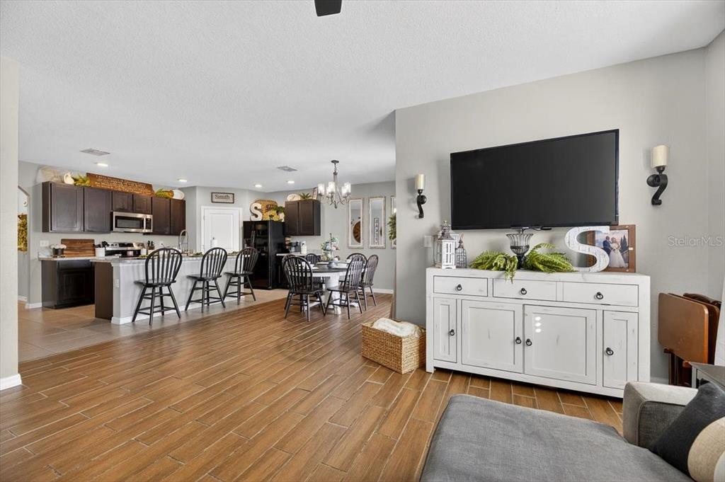 3246 South Northview Road Plant City, FL 33566 - Photo 14 of 57 a living room with furniture and a flat screen tv