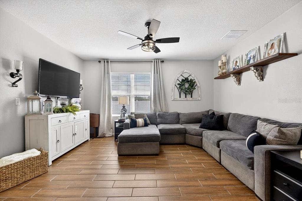 3246 South Northview Road Plant City, FL 33566 - Photo 15 of 57 a living room with furniture and a flat screen tv