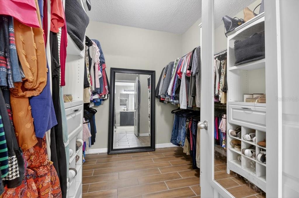 3246 South Northview Road Plant City, FL 33566 - Photo 21 of 57 a view of walk in closet with clothes and shoes
