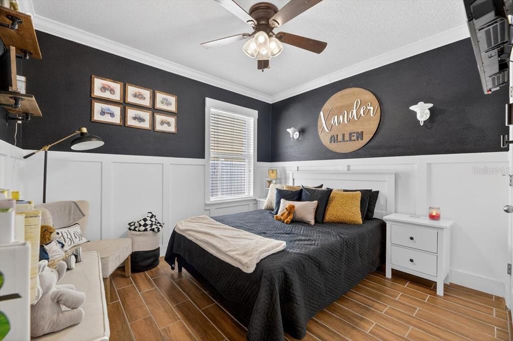 3246 South Northview Road Plant City, FL 33566 - Photo 25 of 57 a bedroom with a bed and wooden floor