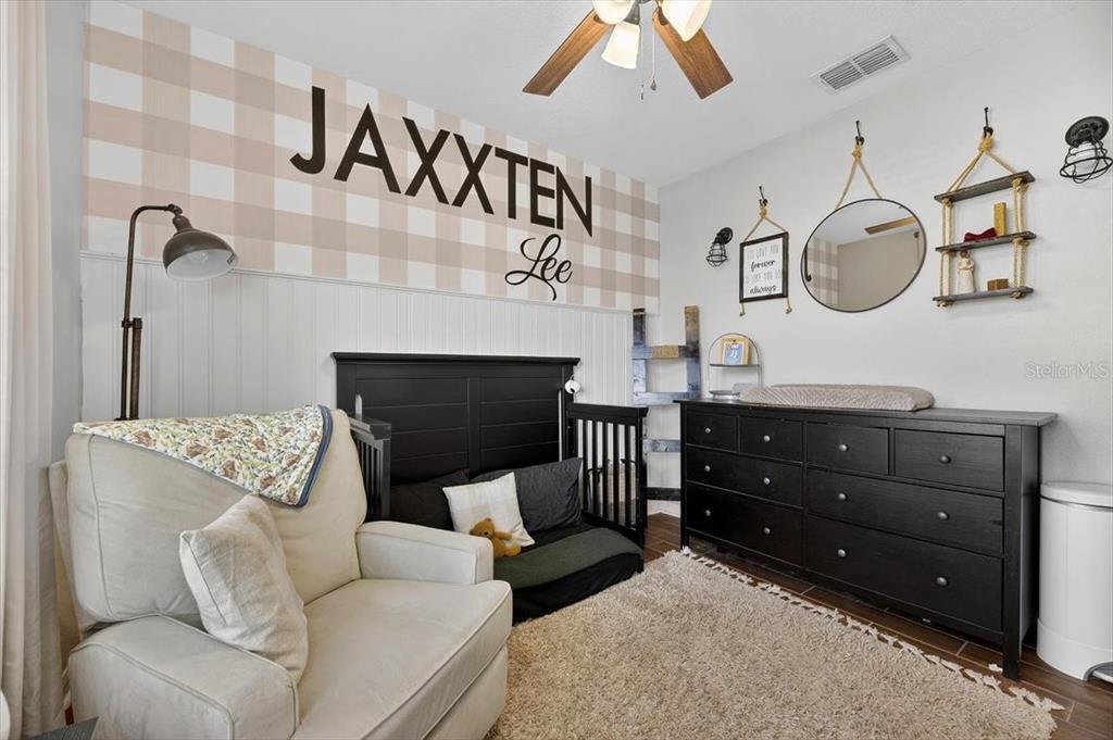 3246 South Northview Road Plant City, FL 33566 - Photo 26 of 57 a living room with furniture and a fireplace