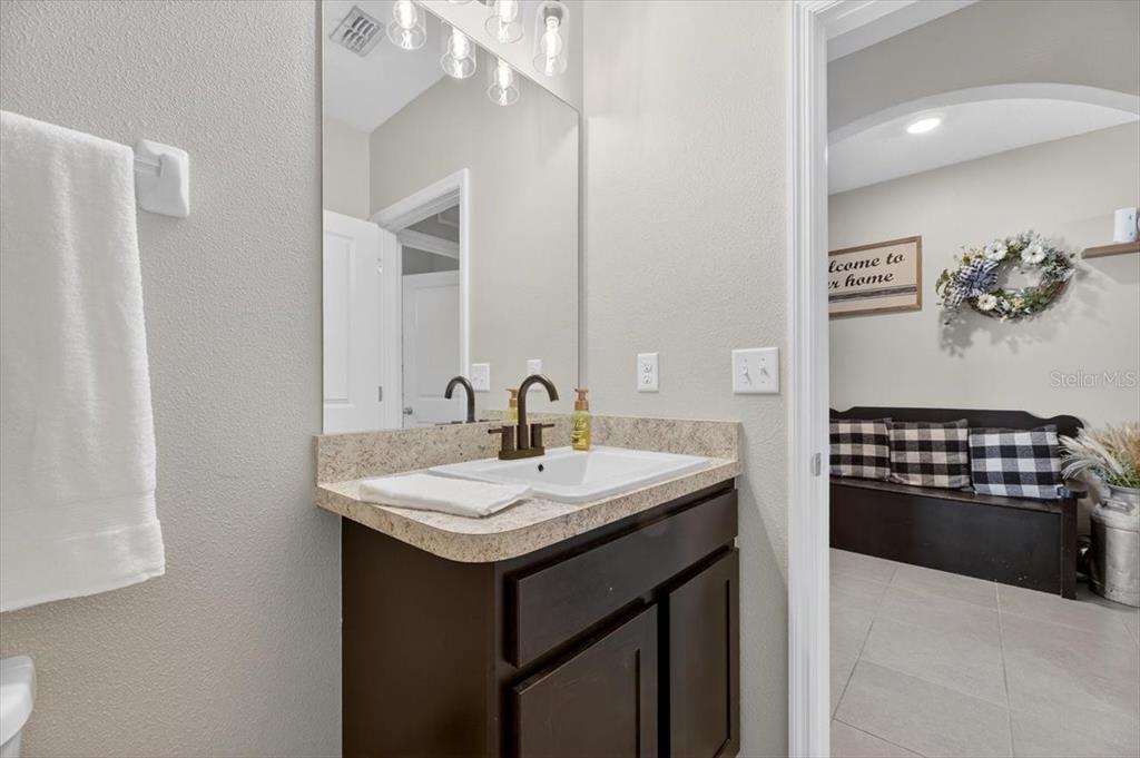 3246 South Northview Road Plant City, FL 33566 - Photo 27 of 57 a kitchen with a sink stove and cabinets