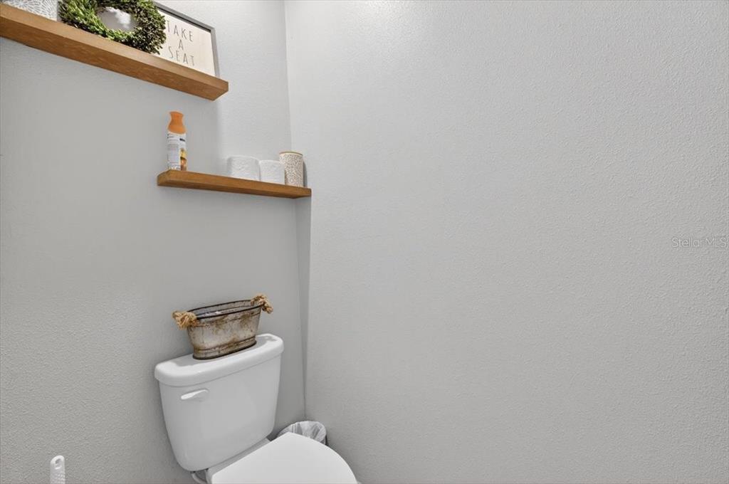 3246 South Northview Road Plant City, FL 33566 - Photo 29 of 57 a white toilet sitting next to a white wall