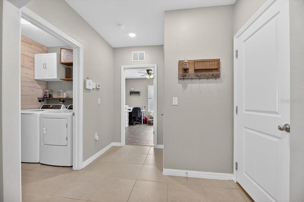 3246 South Northview Road Plant City, FL 33566 - Photo 30 of 57 a view of a kitchen with refrigerator and a stove top oven