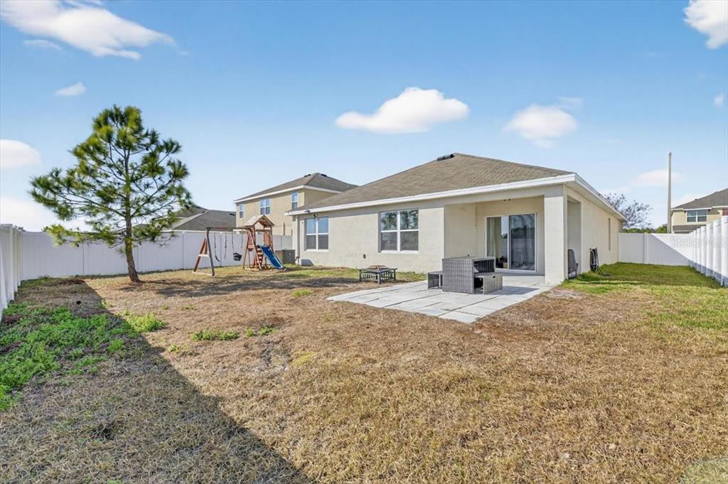 3246 South Northview Road Plant City, FL 33566 - Photo 38 of 57 a front view of a house with a yard and garage